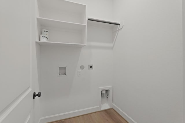 14514 Hueco Mountain Dr, Cypress, TX 77429 - washroom with hookup for an electric dryer, hookup for a washing machine, light wood-style floors, baseboards, and gas dryer hookup