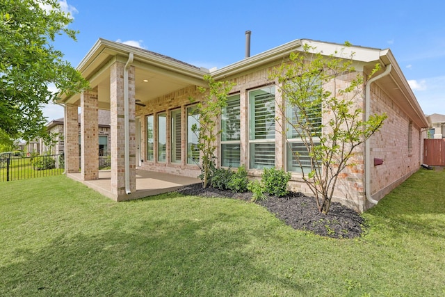 14514 Hueco Mountain Dr, Cypress, TX 77429 - rear view of house with a patio and brick siding