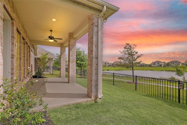 14514 Hueco Mountain Dr, Cypress, TX 77429 - view of yard with a ceiling fan, a water view, and a patio area