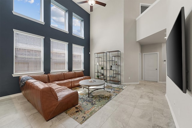 908 Newport Creek Dr, Katy, TX 77493 - living room with a towering ceiling, baseboards, and ceiling fan