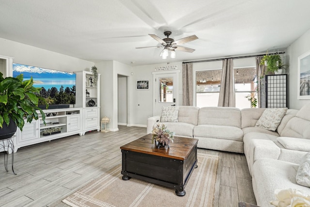 8010 Clover Leaf Dr, Rosenberg, TX 77469 - living room with ceiling fan, baseboards, and wood finished floors