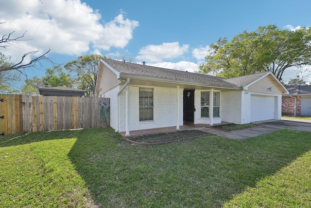 5347 Inwood Dr, Katy, TX 77493 - view of front of home with driveway, a front yard, brick siding, a garage, and fence