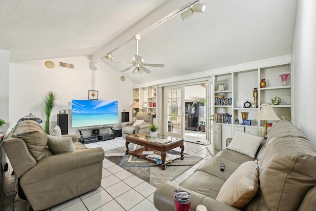 5347 Inwood Dr, Katy, TX 77493 - living area featuring lofted ceiling with beams, light tile patterned floors, french doors, a ceiling fan, and visible vents