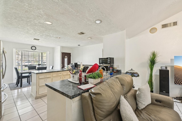 5347 Inwood Dr, Katy, TX 77493 - living area with visible vents, recessed lighting, light tile patterned flooring, and a textured ceiling