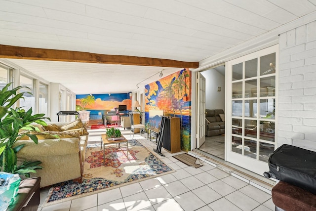 5347 Inwood Dr, Katy, TX 77493 - living area featuring beamed ceiling and tile patterned flooring