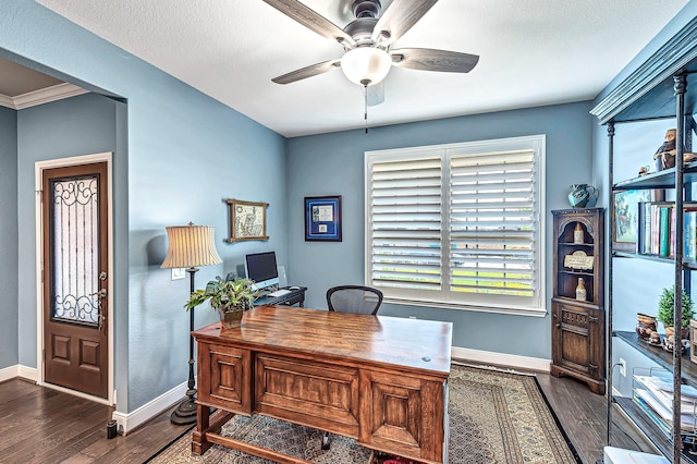 office area with dark wood finished floors, baseboards, and a ceiling fan