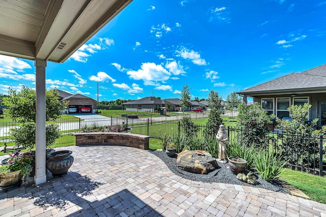 view of patio / terrace featuring a residential view and fence private yard