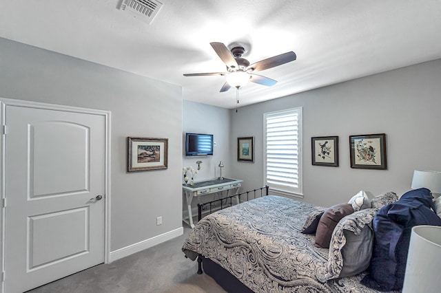 carpeted bedroom with ceiling fan, baseboards, and visible vents