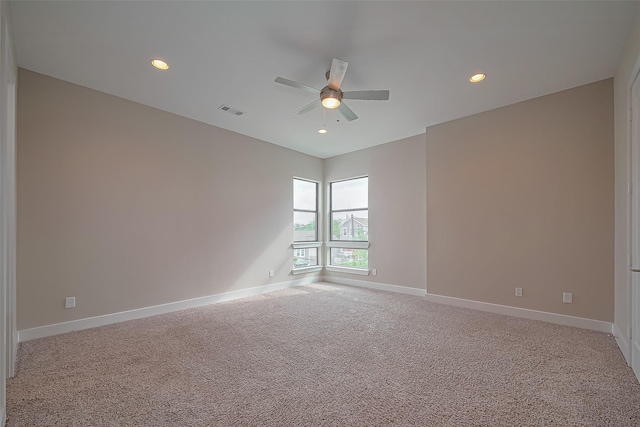 1305 Laird St, Houston, TX 77008 - unfurnished room featuring a ceiling fan, light carpet, baseboards, and recessed lighting