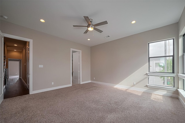 1305 Laird St, Houston, TX 77008 - unfurnished bedroom with dark colored carpet, recessed lighting, baseboards, and ceiling fan