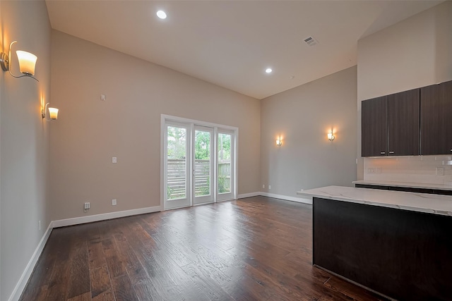 1305 Laird St, Houston, TX 77008 - unfurnished living room featuring dark wood finished floors, baseboards, and recessed lighting