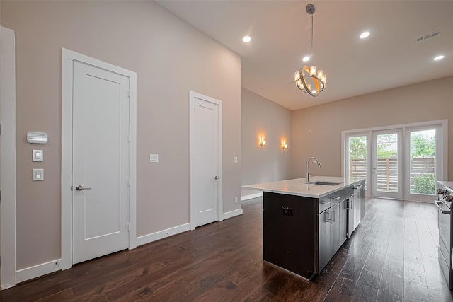 1305 Laird St, Houston, TX 77008 - kitchen featuring a sink, dark wood finished floors, light countertops, baseboards, and recessed lighting