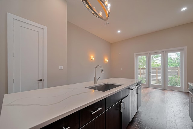 1305 Laird St, Houston, TX 77008 - kitchen with a sink, light wood-style floors, recessed lighting, vaulted ceiling, and light stone counters