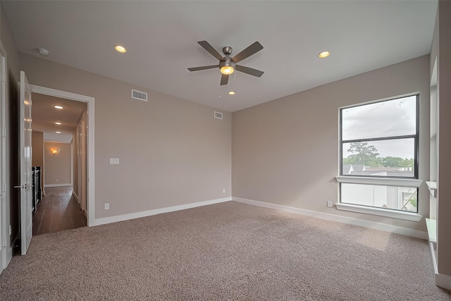 1305 Laird St, Houston, TX 77008 - spare room featuring carpet flooring, a ceiling fan, recessed lighting, baseboards, and a smoke detector