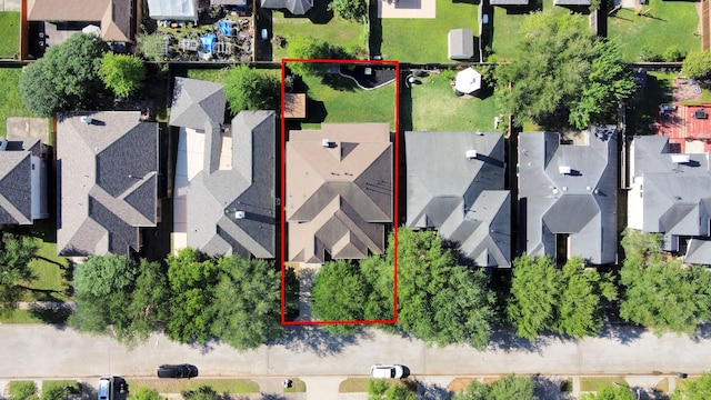 birds eye view of property with a residential view