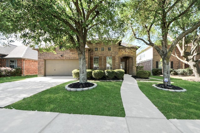 view of front of home featuring brick siding, a front yard, an attached garage, and concrete driveway