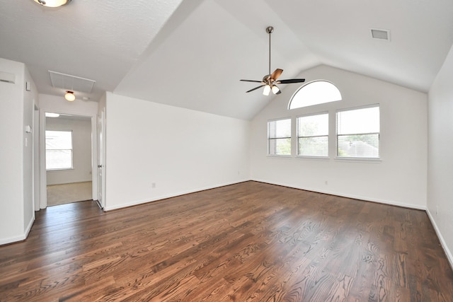 interior space with attic access, ceiling fan, visible vents, and dark wood-style flooring