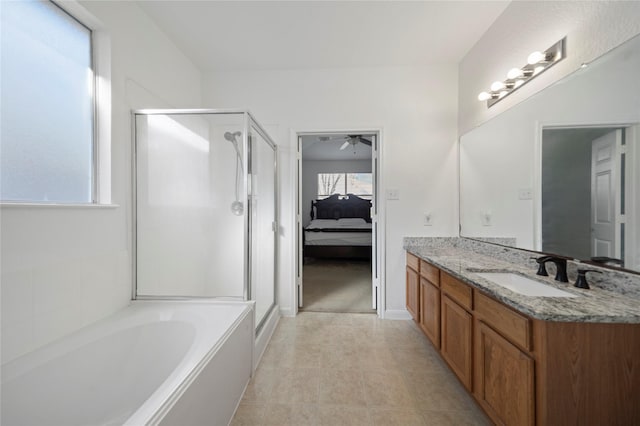 21355 Bella Mountain Dr, Spring, TX 77379 - ensuite bathroom featuring vanity, a stall shower, ensuite bathroom, a ceiling fan, and a garden tub