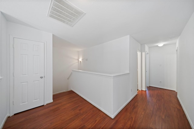 21355 Bella Mountain Dr, Spring, TX 77379 - hallway featuring visible vents, baseboards, an upstairs landing, and wood finished floors