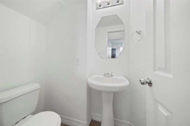 21355 Bella Mountain Dr, Spring, TX 77379 - bathroom featuring toilet, a sink, and baseboards