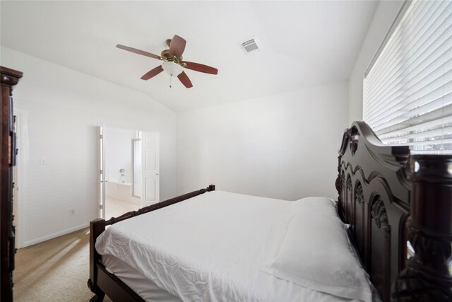 21355 Bella Mountain Dr, Spring, TX 77379 - bedroom featuring ensuite bath, visible vents, vaulted ceiling, light carpet, and baseboards