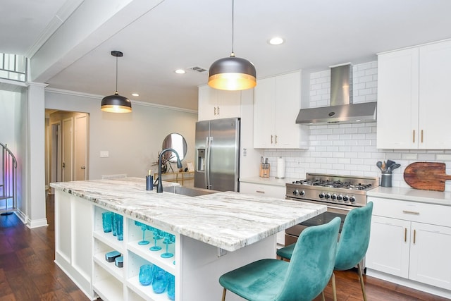 5902 Hummingbird St, Houston, TX 77096 - kitchen featuring wall chimney exhaust hood, appliances with stainless steel finishes, a sink, crown molding, and backsplash