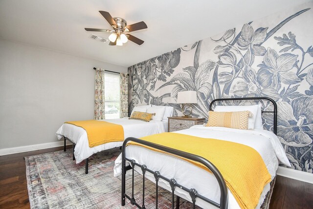 5902 Hummingbird St, Houston, TX 77096 - bedroom with baseboards, wood finished floors, ceiling fan, and wallpapered walls