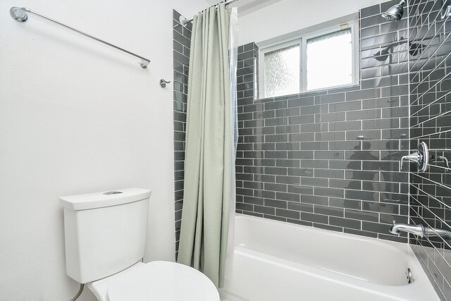 5902 Hummingbird St, Houston, TX 77096 - bathroom featuring toilet and shower / bath combo