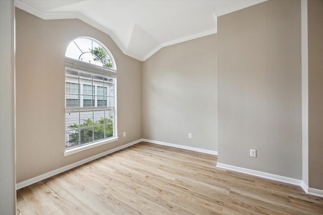 4422 Castle Court Pl, Houston, TX 77006 - spare room featuring plenty of natural light, ornamental molding, wood finished floors, and vaulted ceiling