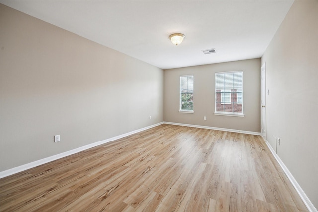 4422 Castle Court Pl, Houston, TX 77006 - spare room with light wood-style floors and baseboards