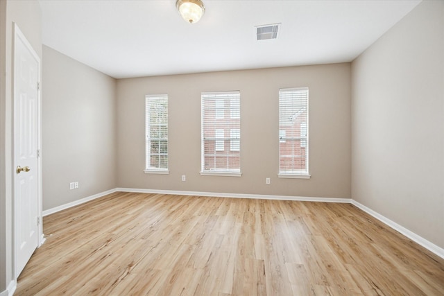 4422 Castle Court Pl, Houston, TX 77006 - spare room featuring light wood-style floors and baseboards