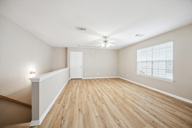 4422 Castle Court Pl, Houston, TX 77006 - empty room featuring attic access, light wood-style flooring, and ceiling fan