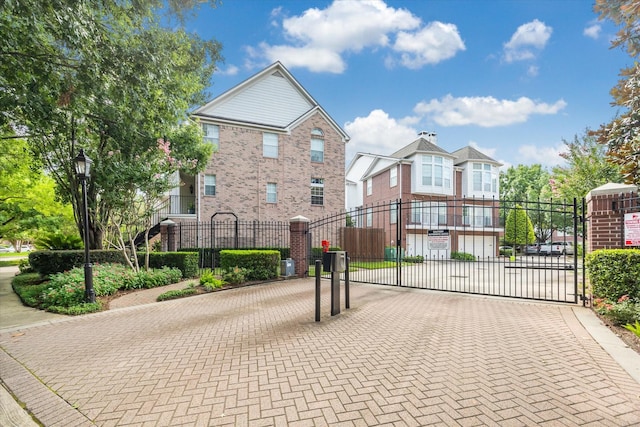 4422 Castle Court Pl, Houston, TX 77006 - view of decorative street with a gate, a gated entry, and curbs