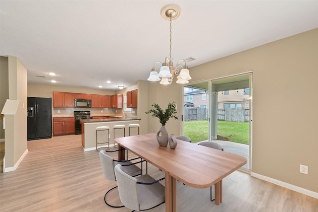 dining space featuring visible vents, baseboards, a chandelier, light wood-style floors, and recessed lighting