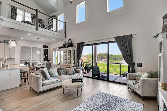 living area featuring recessed lighting and light wood-style floors