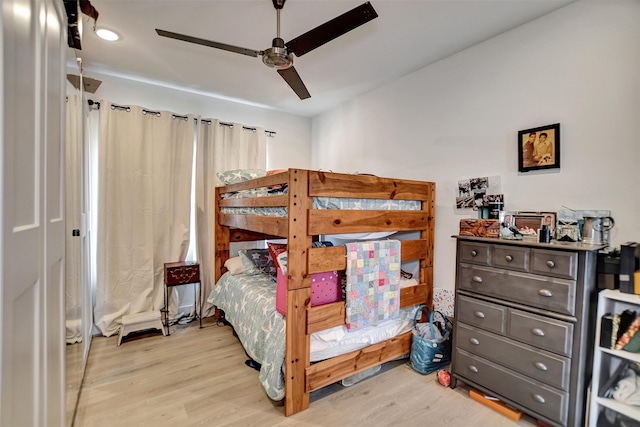 bedroom featuring a ceiling fan and wood finished floors