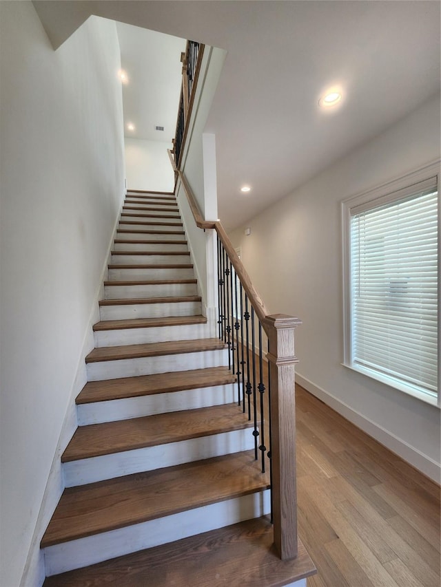 409 Forest Reserve Pl, Houston, TX 77079 - staircase with wood finished floors, baseboards, and recessed lighting