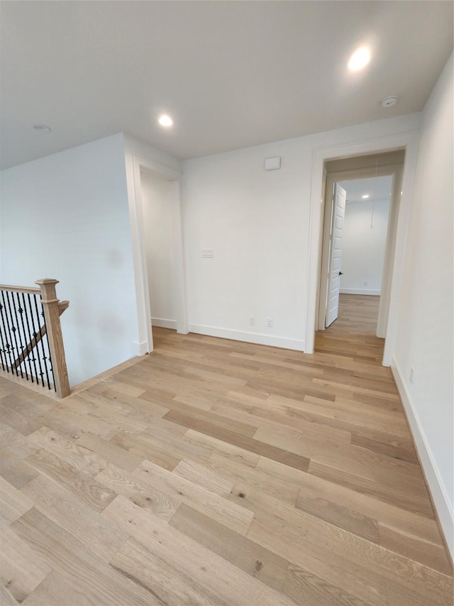 409 Forest Reserve Pl, Houston, TX 77079 - empty room with light wood-style floors, recessed lighting, a smoke detector, and baseboards