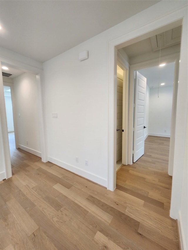 409 Forest Reserve Pl, Houston, TX 77079 - empty room featuring attic access, light wood finished floors, and baseboards