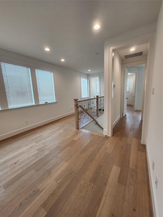 409 Forest Reserve Pl, Houston, TX 77079 - corridor featuring an upstairs landing, light wood finished floors, baseboards, and recessed lighting