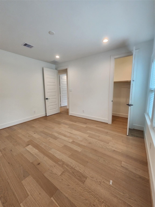 409 Forest Reserve Pl, Houston, TX 77079 - spare room featuring light wood finished floors, recessed lighting, and baseboards
