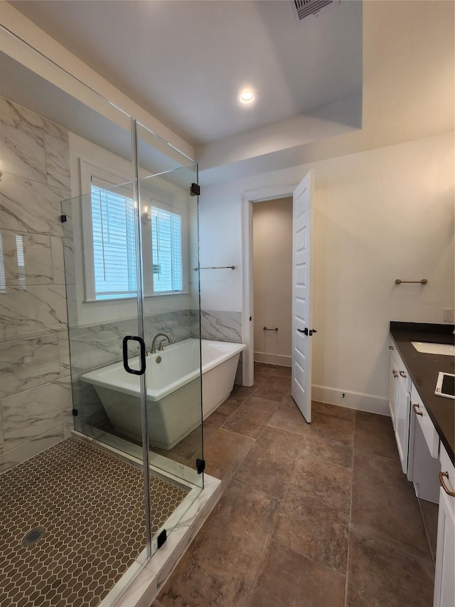 409 Forest Reserve Pl, Houston, TX 77079 - full bathroom with a freestanding tub, a marble finish shower, vanity, and baseboards