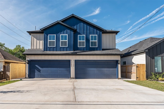 8132 Brandon St, Houston, TX 77051 - view of front of house with an attached garage, board and batten siding, concrete driveway, and fence