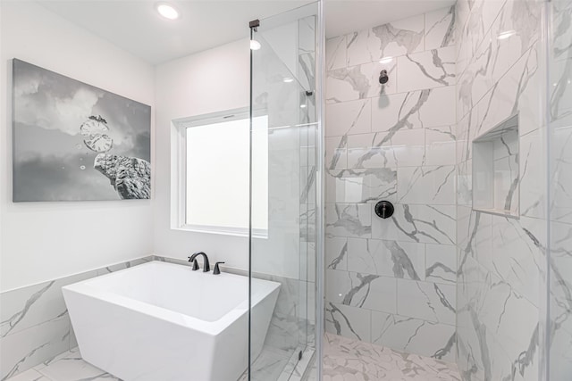 8132 Brandon St, Houston, TX 77051 - full bathroom featuring a stall shower, a freestanding tub, and marble finish floor