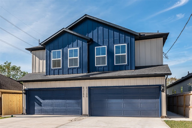 8132 Brandon St, Houston, TX 77051 - view of front of property featuring concrete driveway, board and batten siding, an attached garage, fence, and a shingled roof