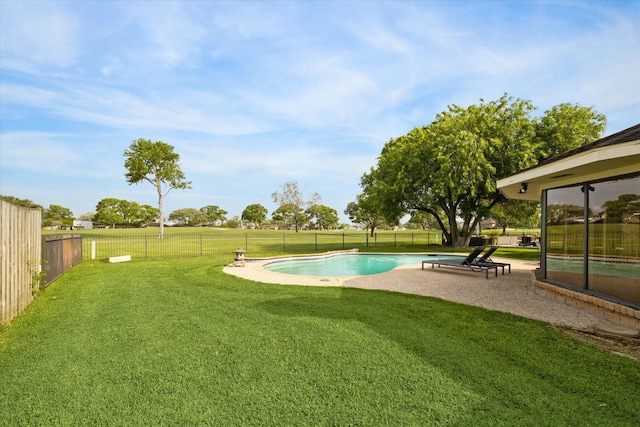 view of swimming pool featuring a yard, a fenced in pool, a patio, and a fenced backyard