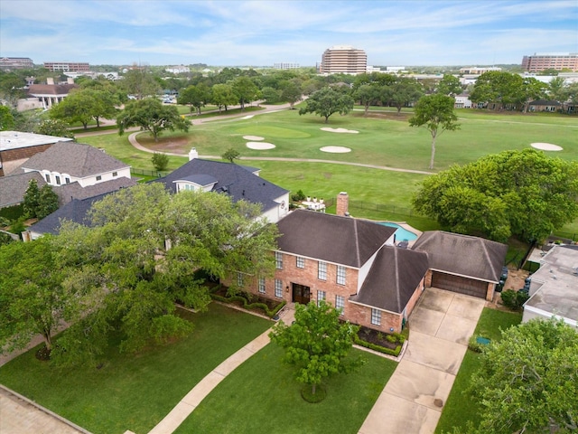 bird's eye view with view of golf course