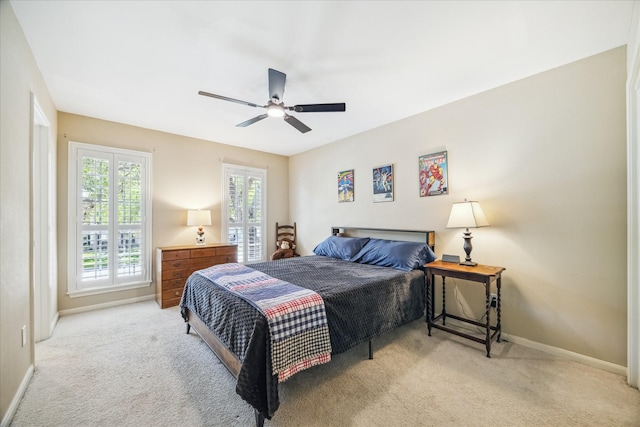 carpeted bedroom with baseboards and ceiling fan