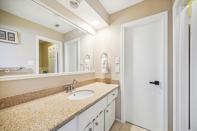 bathroom featuring vanity, tile patterned flooring, and visible vents