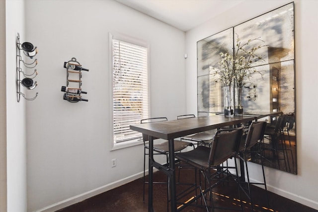 dining space featuring baseboards